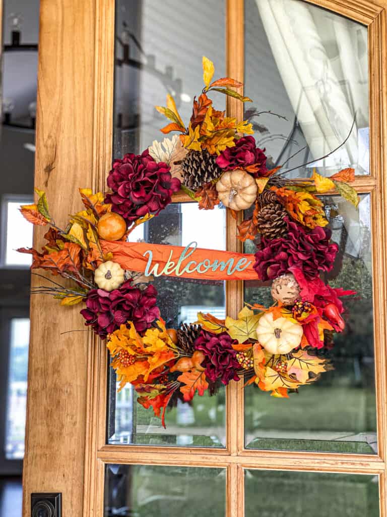 Fall wreath with leaves and pumpkins