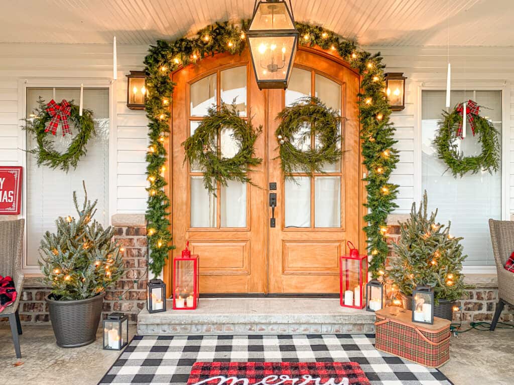 Fresh evergreen wreaths with bells and lights.