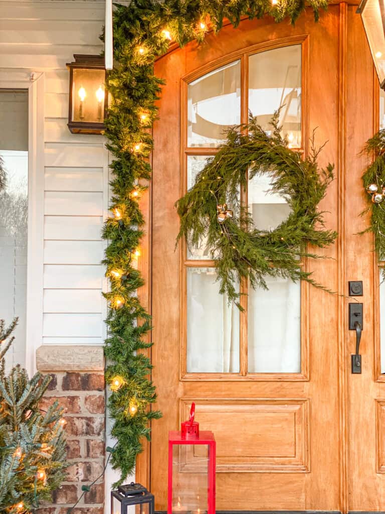 fresh evergreen wreath with bells and lights